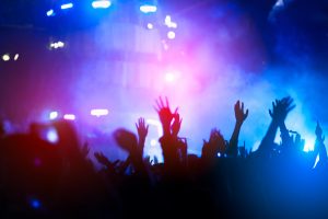 INICIO silhouettes of hand in concert.light from the stage.